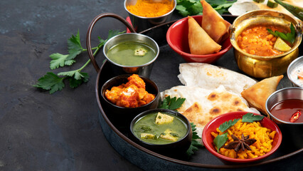 Indian Thali on dark background.