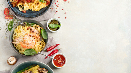 Italian pasta assortment on light background.