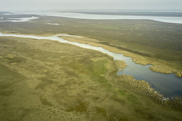 steppe plain landscape lake in the middle of fields
