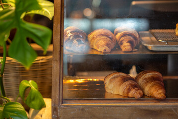 Croissant in a glass cabinet