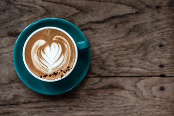 cup of coffee on wooden table