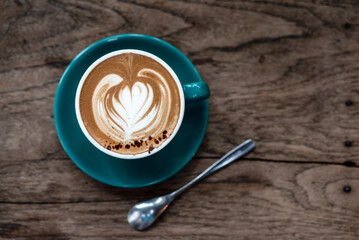 cup of coffee on wooden table