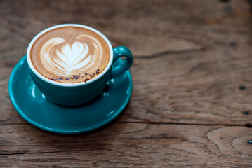 cup of coffee on wooden table