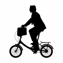 Fototapeta Silhouette of a office man riding a bicycle obraz