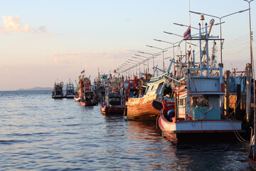 Fototapeta premium Fishing boats moored at the pier in the evening.