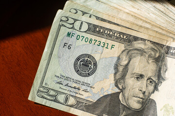 stack of twenty dollars banknotes, close up, front side