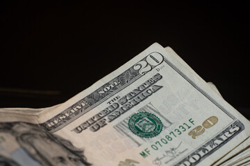 stack of twenty dollars banknotes, close up, front side