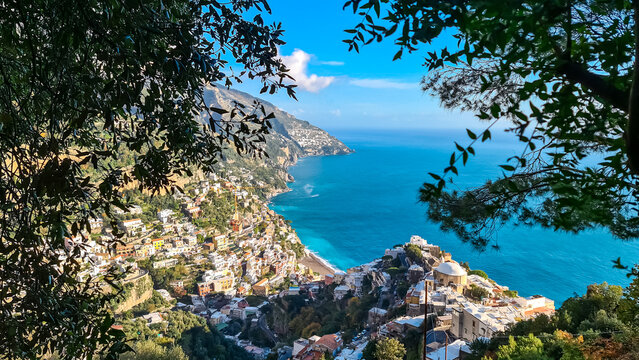 Scenic aerial view from hiking trail leading to coastal town of Positano, Praiano. Hiking Lattari Mountains, Apennines, Amalfi Coast, Campania, Italy, Europe. Vacation at Tyrrhenian Mediterranean Sea