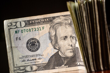 stack of twenty dollars banknotes, close up, front side