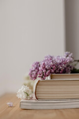 Books, magazines, flowers on the window. Floral interior. White flowers in the interior. Place for text, floral background