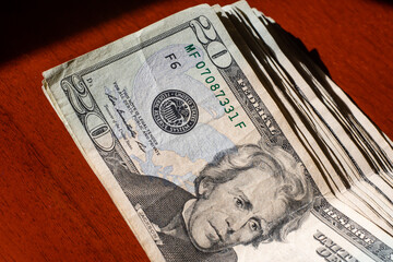 stack of twenty dollars banknotes, close up, front side