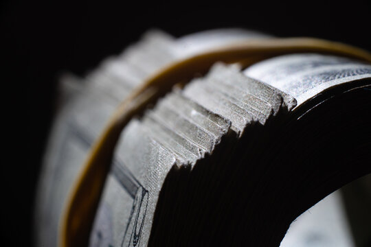 twisted stack of twenty-dollar American dollar banknotes