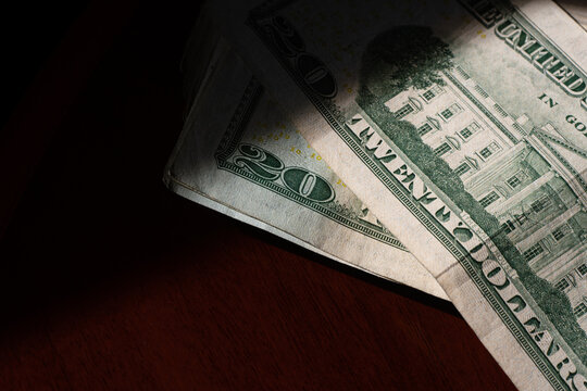 stack of twenty american dollars banknotes on table, close up, reverse side