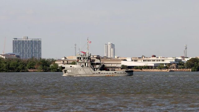 The HTMS Rung Tugboat YTM-854 Ships of the Royal Thai Navy sail on the Chao Phraya river