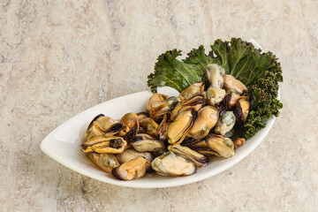 Tasty marinated mussels in the bowl