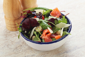 Mix salad with salmon, corn and tomato