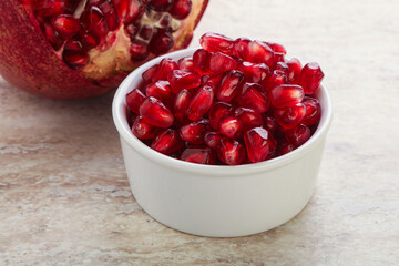 Ripe red Pomegranate seeds in the bowl