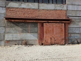 Fototapeta na wymiar Old Gate of an Industrial Building