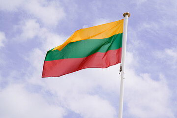Lithuania Lithuanian flag wave over a cloudy sky