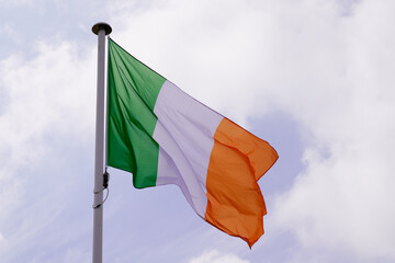 ireland flag irish wave over a cloudy sky