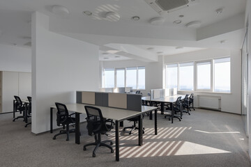 large office with several jobs, interior of modern office, modern office with panoramic windows and...