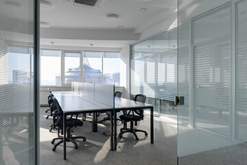 modern bright office with glass partitions, interior of modern office