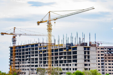 Home construction. How a tower crane builds a house