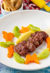 Turkish meatball traditional kofte. with carrots and zucchini cut into animal shapes. Spicy...