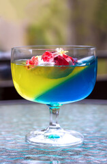 Jelly cocktail in the traditional colors of independent Ukraine blue - yellow, delicious summer multi-colored dessert