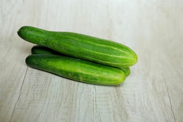 cucumbers on a wooden background