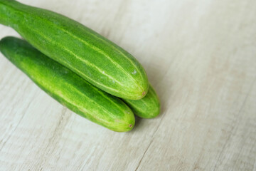 cucumbers on a wooden background