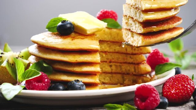 stack of pancakes and berries fruits