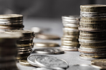 Lots of coins. The concept of investing or saving money or a financial crisis