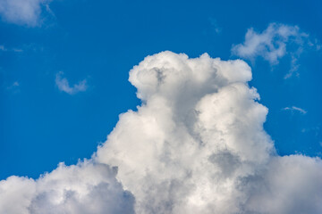 Beautiful storm clouds, cumulus clouds or cumulonimbus against a clear blue sky. Photography, Full frame.