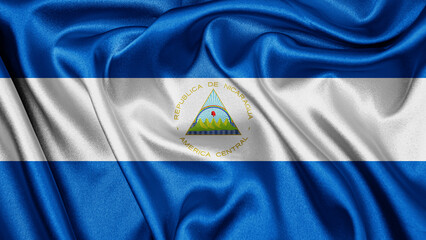 Close up realistic texture fabric textile silk satin flag of Nicaragua waving fluttering...