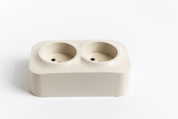Double socket on a white background. two sockets, united by one monolithic case. The socket has two plug connectors, but is installed in one standard socket. electrical goods store.