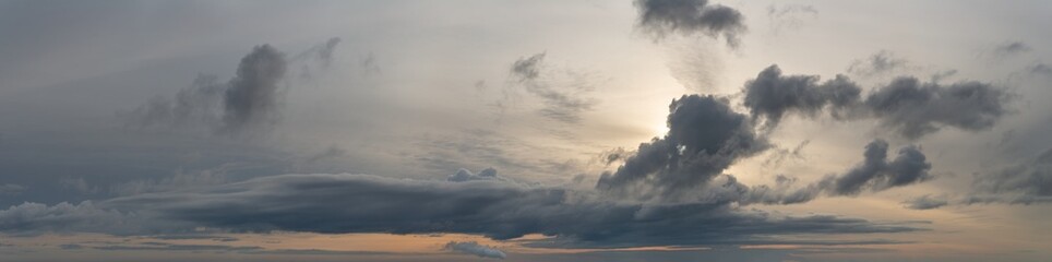 Fototapeta na wymiar Fantastic soft thunderclouds at sunrise, natural composition