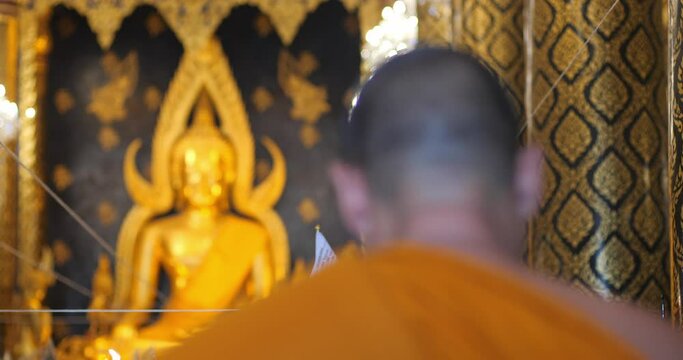 Monks are chanting a Buddhist ritual. Pray and meditation in temple, Thailand