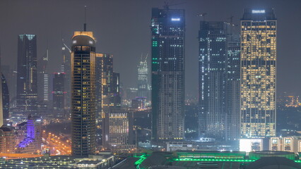 Aerial view of Dubai International Financial Centre DIFC district night timelapse
