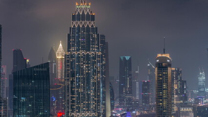 Fototapeta na wymiar Aerial view of Dubai International Financial Centre DIFC district night timelapse