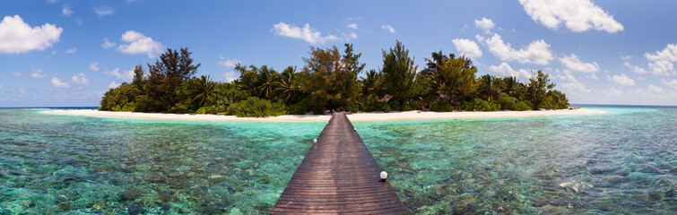 Beach view from Jetty above the Coral reef of tropical island