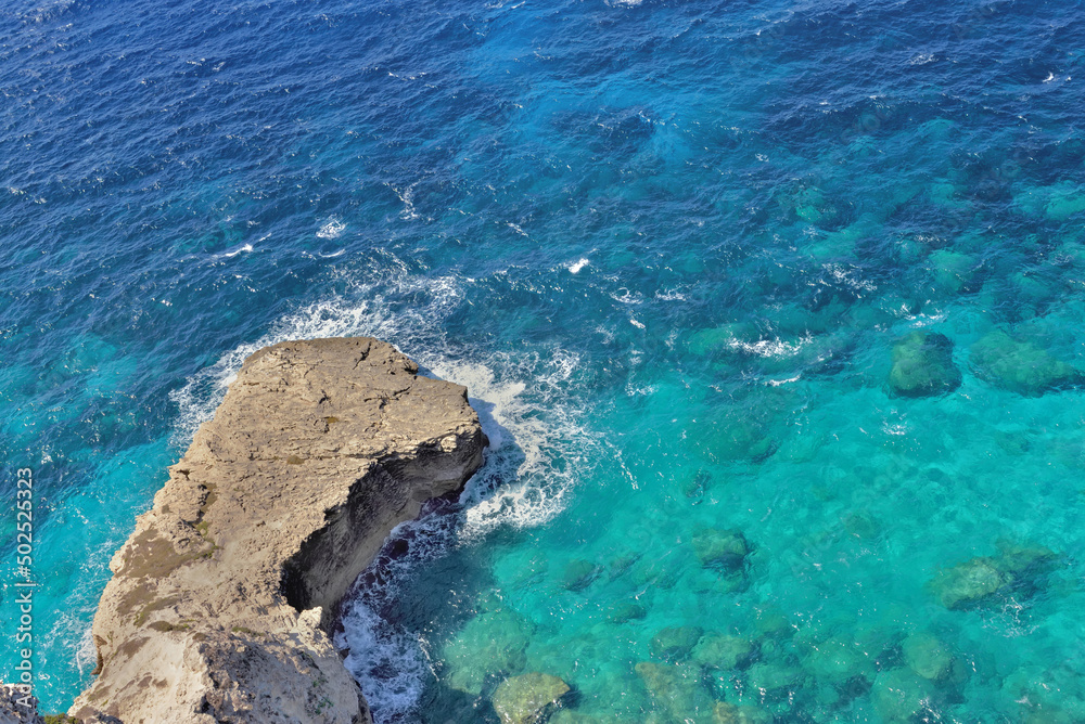 Wall mural view above a clear sea blue turquoise and rock in Corsica island at Bonifacio