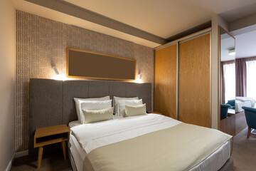 Fototapeta na wymiar Interior of a luxury hotel double bed bedroom
