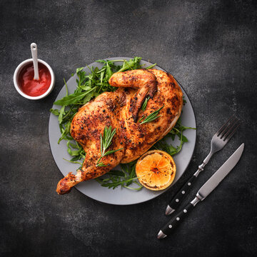 Grilled chicken. Half baked chicken with lemon and spices. Delicious juicy chicken. Grilled poultry.