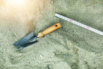Shovel in the sand.Skeleton and archaeological tools.Digging for fossils.