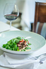 Sous Vide Roast Beef European Cuisine, Spinach, Strawberries, Wine on Served Table, Restaurant Food