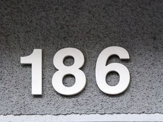 Metal home number on a wall
