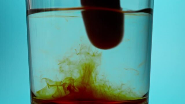 Mixing brown antiseptic liquid and water