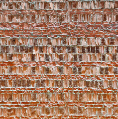Broken red bricks wall as construction background