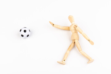 Wooden mannequin with soccer ball isolated on white background. Football player concept.